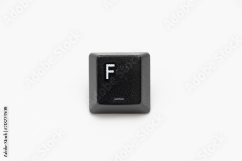 Single black keys of keyboard with different letters F