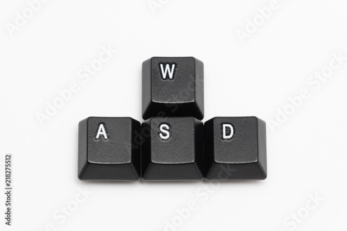 Single black keys of keyboard with different letters WASD