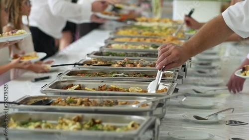 people in all you can eat catering buffet food indoor in luxury restauran.