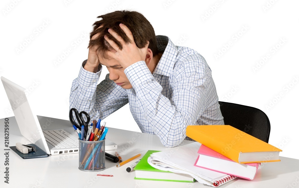 Teen male student freaking out over homework Teen male student freaking out over homework