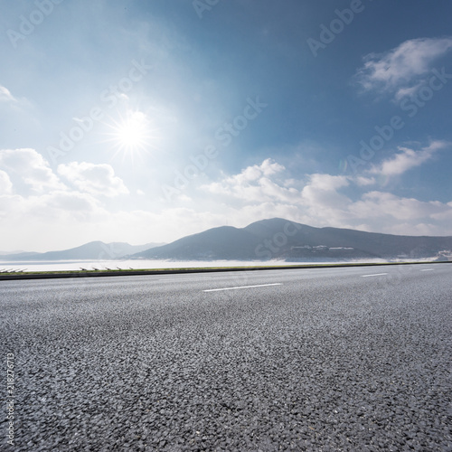 Wallpaper Mural highway through mountain with blue sky Torontodigital.ca