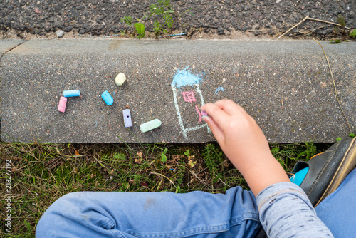 children's drawings with crayons on the pavement photo