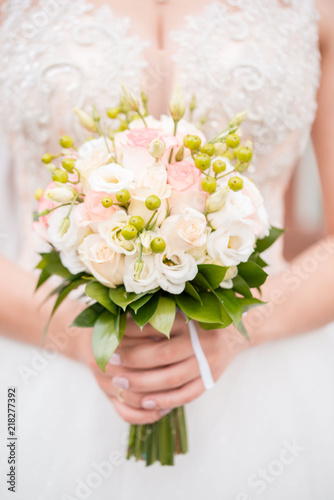 Wedding bouquet of the bride. Wedding day. Happy bride. The bride's bouquet. Beautiful bouquet of white flowers. Beautiful flowers. photo