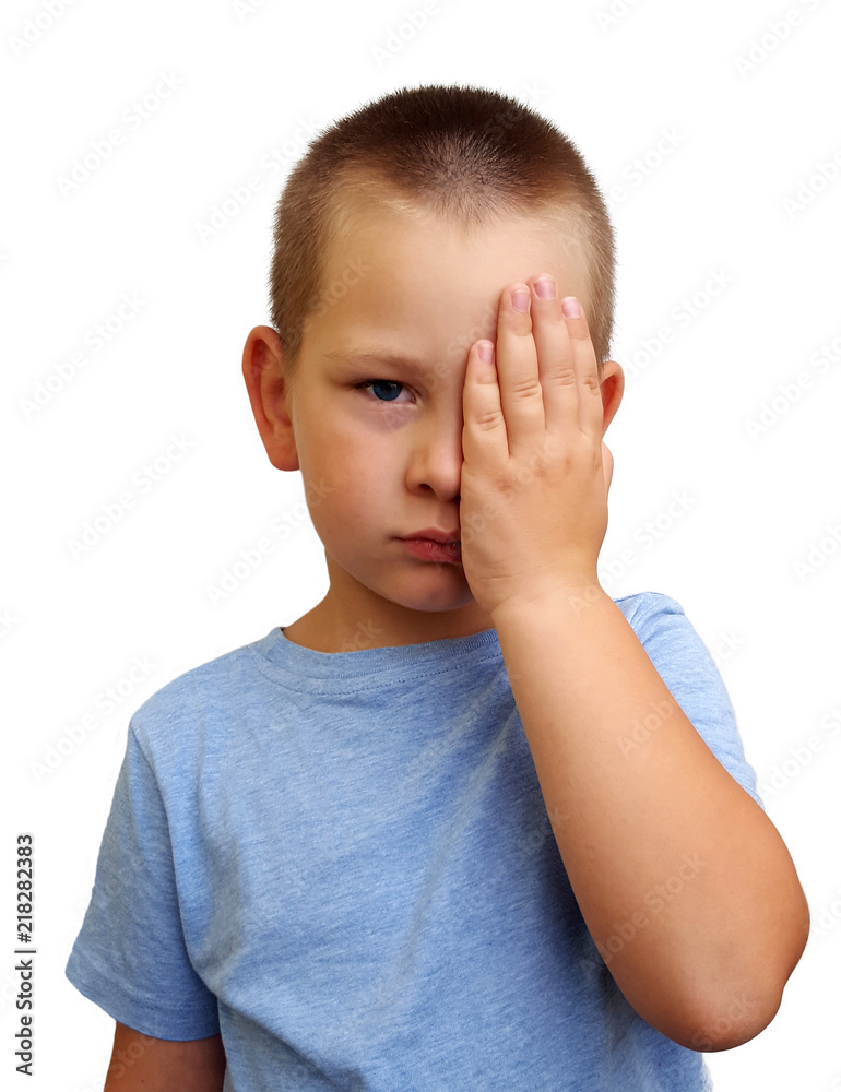 Little boy covering one eye with palm for eyesight exam Little boy covering one eye with palm for eyesight exam