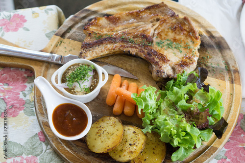 Delicious pork steak with organic salad