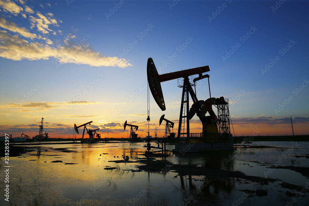 The pumping unit is working in the setting sun