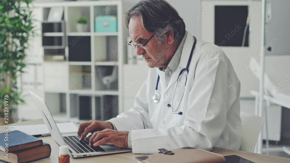 Doctor working with laptop computer