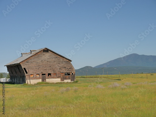 old leaning barn in field