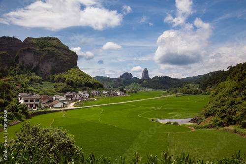 Candle Peak - Pepper Peak Scenic Area of Lang Mountain, Langshan - China National Geopark, Xinning County Hunan province. Unique Danxia Landform, UNESCO Natural World Heritage. Red Danxia, Rice Fields photo