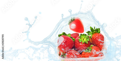 packaged strawberries in water splash