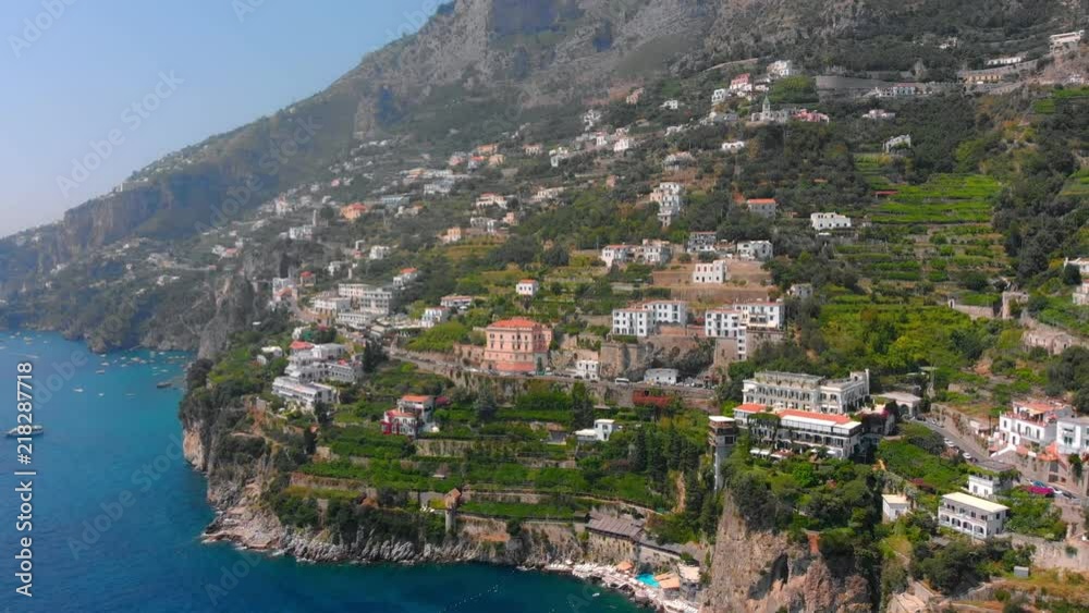 Aerial flying towards cliffs in Amalfi a town in province of Salerno in region of Campania Italy showing the unique architecture of the area Aerial flying towards cliffs in Amalfi a town in province of Salerno in region of Campania Italy showing the unique architecture of the area