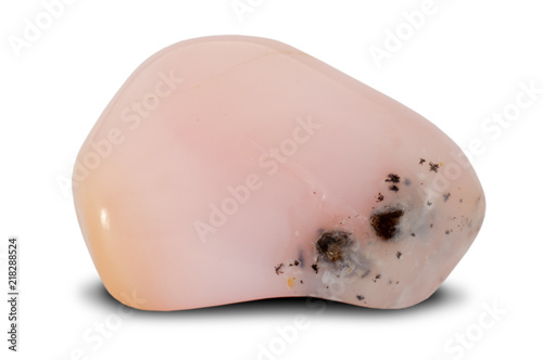 Polished pink opal stone isolated on white background