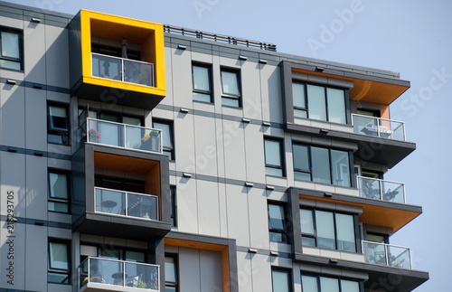 Yellow highlights in exterior of a condo building in Victoria downtown photo