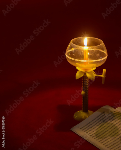reading a book in candle light