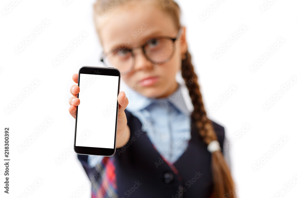 school girl holding mobile phone with white empty screen isolated on white background