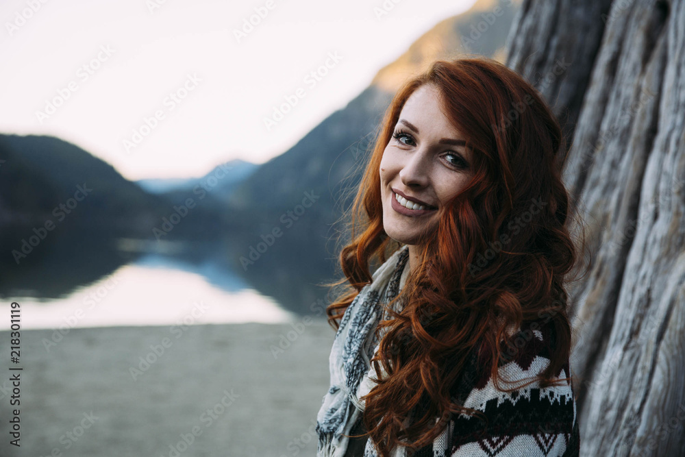 Redhead Student Hanging Out At The Park By The Lake