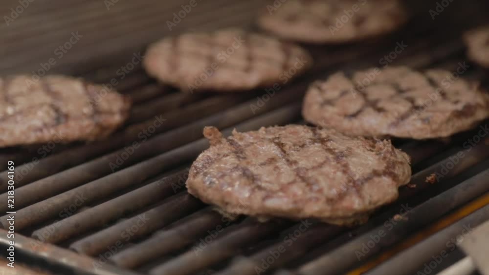 Burgers on Grill in Slow Motion Burgers on Grill in Slow Motion