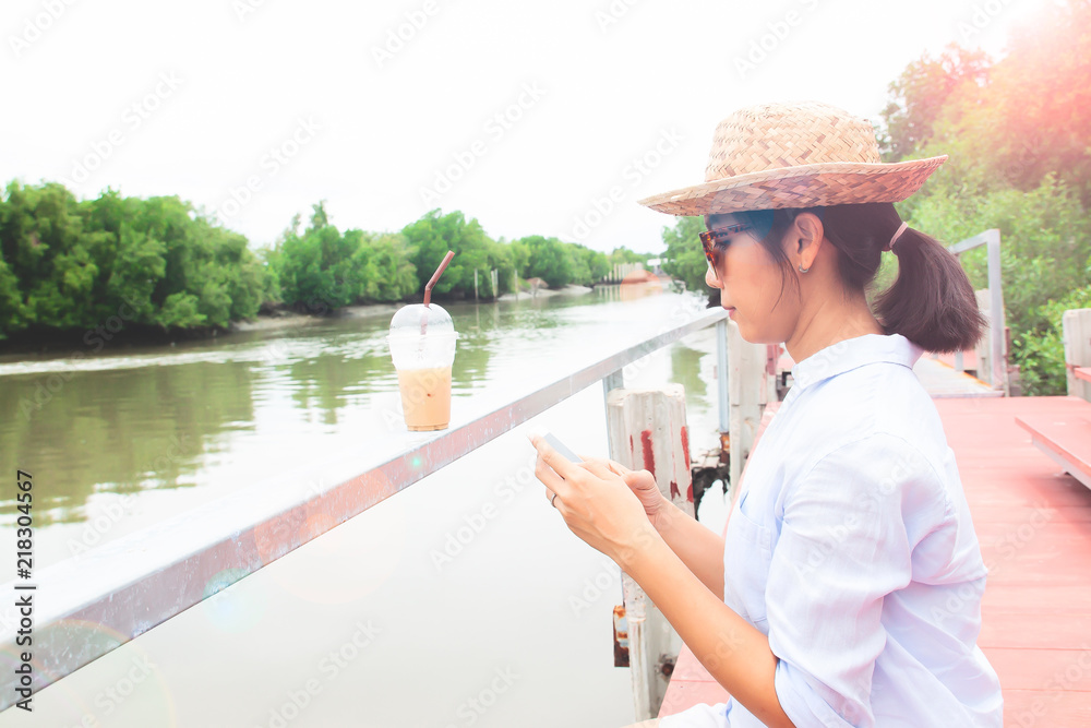 Asian woman using mobile phone, Lifestyle and Travel concept