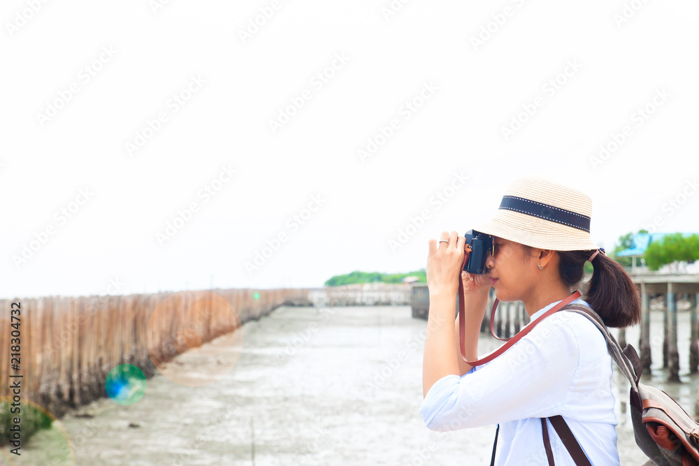 Asian woman with camera, Summer travel or Happy woman concept