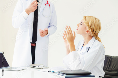 Female doctor at hospital talking to her partner. photo