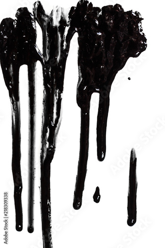 Flows of black glossy paint close-up isolated on a white background