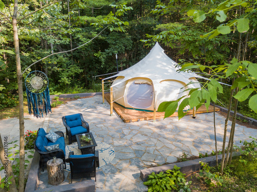 Obraz na płótnie Aerial drone shot of a glamping tent in a forest w salonie