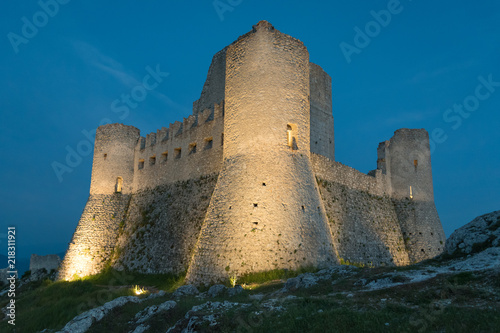 Rocca Calascio (Italy) - The ruins of an old medieval village with castle and church, over 1400 meters above sea level on the Apennine mountains in the heart of Abruzzo, at sunset.