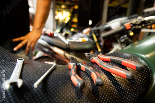 Cafe racer mechanic  and tools 