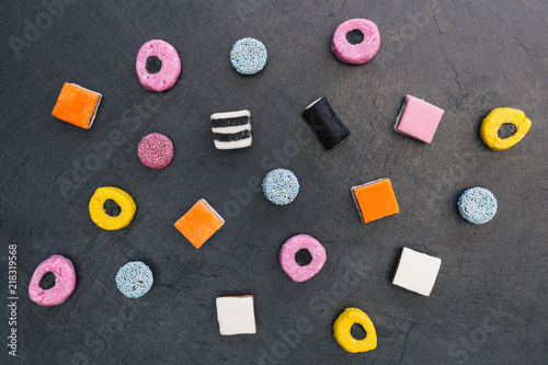 Liquorice allsorts candy sweets dark background
