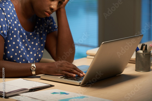 African-American business woman tired of working on laptop