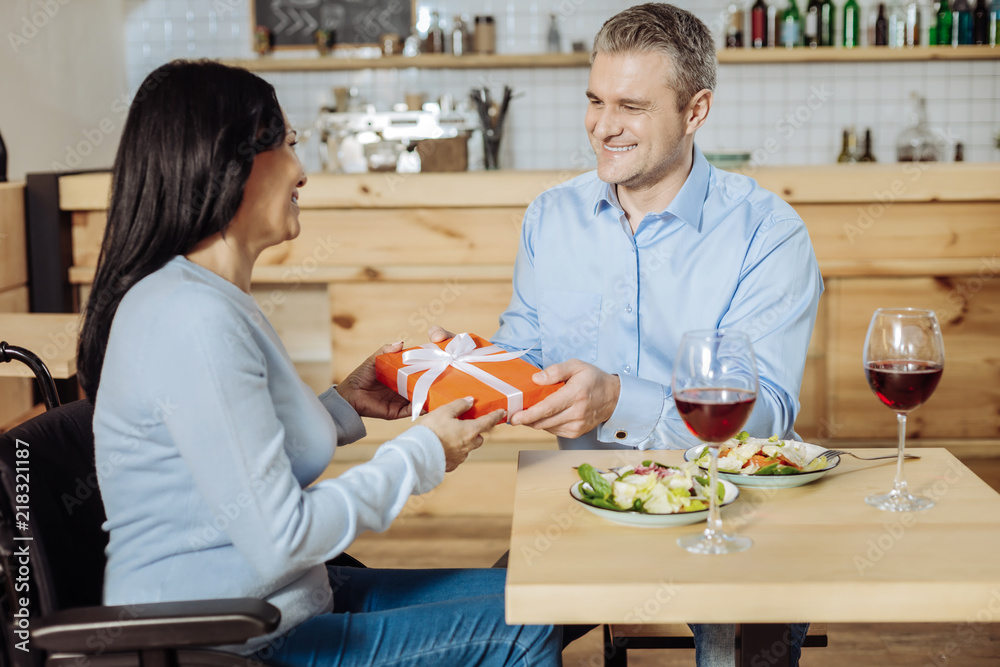 Positive vibes. Joyful happy couple having a conversation while celebrating an important day Positive vibes. Joyful happy couple having a conversation while celebrating an important day