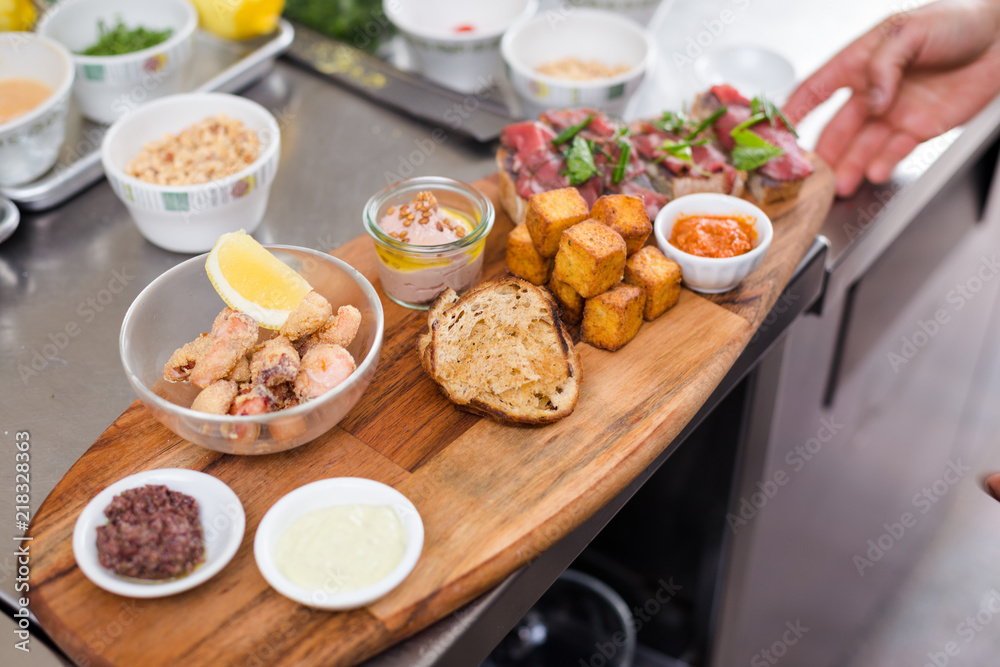 An artisan appetizer board with frito misto. An artisan appetizer board with frito misto.