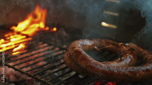 Slow Motion Homemade Sausage Barbecue Cooking And Smoking Closeup High Contrast Cooking Video Charcoal Fire Underneath