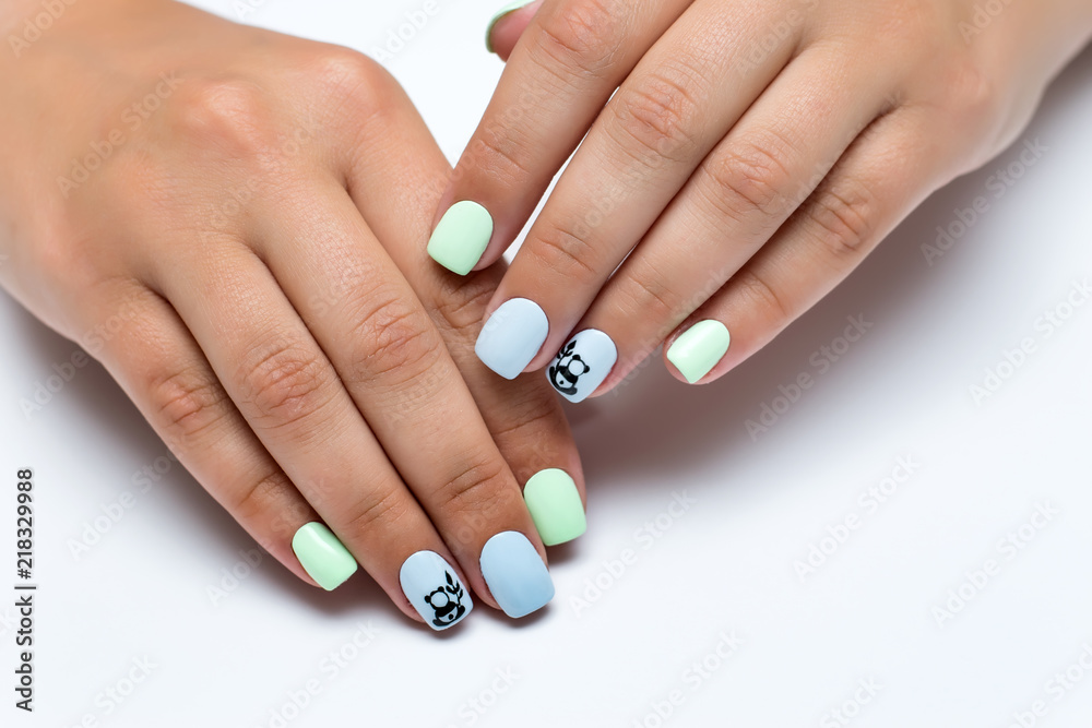 Wunschmotiv: summer mint blue manicure with painted pandas on short square nails on white background