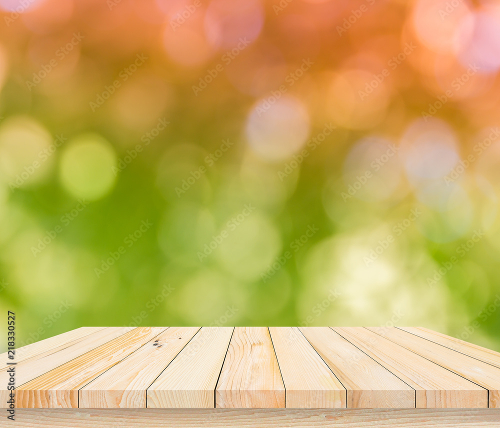 wood plank with abstract green blurred background for product display wood plank with abstract green blurred background for product display