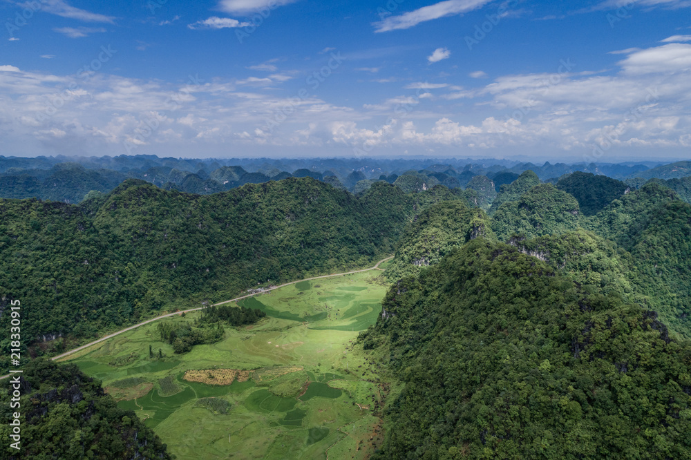 Aerial view of Karst mountains and rice fields