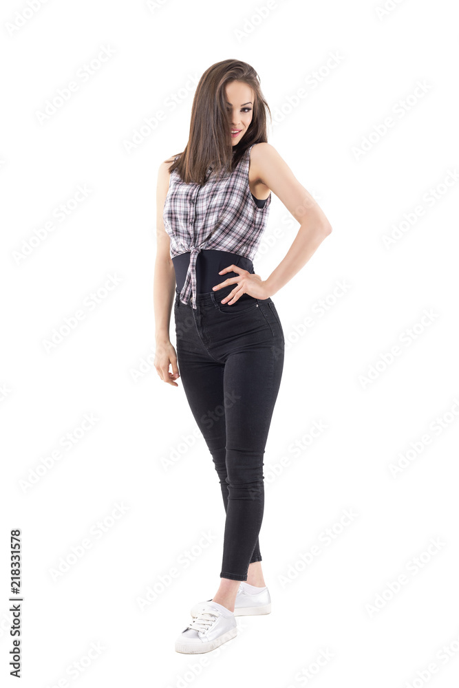 Gorgeous brunette hipster woman posing with hair covering face. Full body isolated on white background. Gorgeous brunette hipster woman posing with hair covering face. Full body isolated on white background.