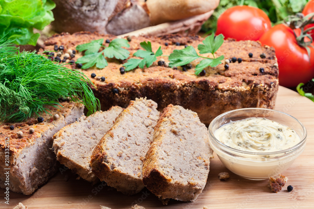 Traditional delicious meat pate with chicken liver on cutting board Traditional delicious meat pate with chicken liver on cutting board