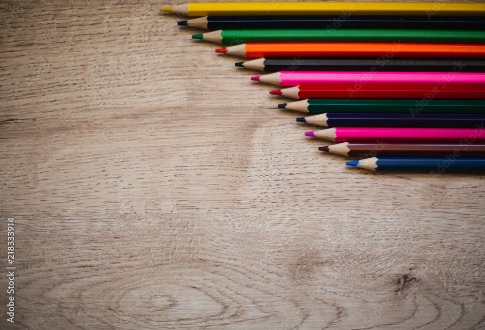 Background With Colored Pencils On Wooden Background. Back To School Concept Background With Colored Pencils On Wooden Background. Back To School Concept