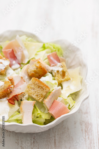 salad with chicken and smoked meat in beautiful bowl