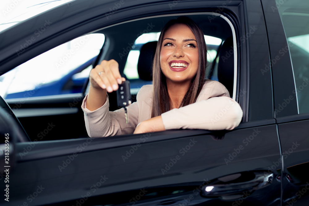 Young Happy Woman Showing The Key Of New Car