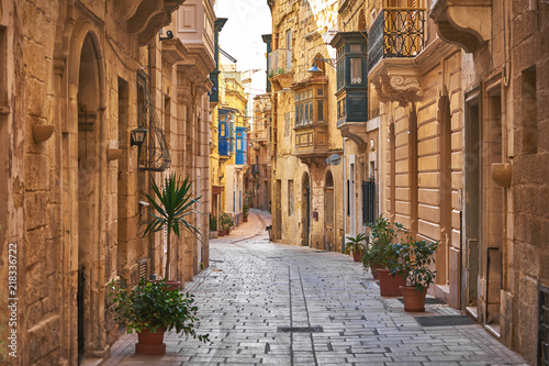 Walking cobblestone street in Birgu city, Malta