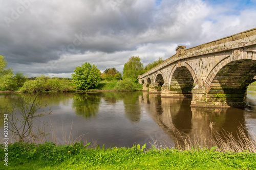 Atcham Old Bridge over the River Severn in Atcham, near Shrewsbury, Shropshire, England, UK