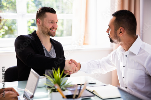 Fotografie Two Businessmen Shaking Hands