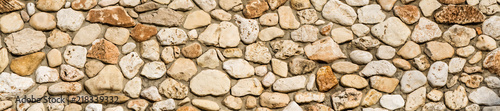 Fotografering Stone wall texture background, panorama of masonry