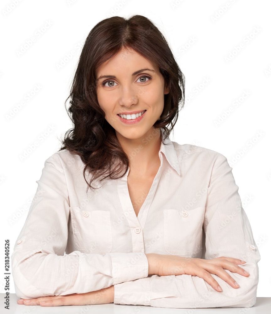 Smiling Young Businesswoman Sitting at The Desk - Isolated Smiling Young Businesswoman Sitting at The Desk - Isolated