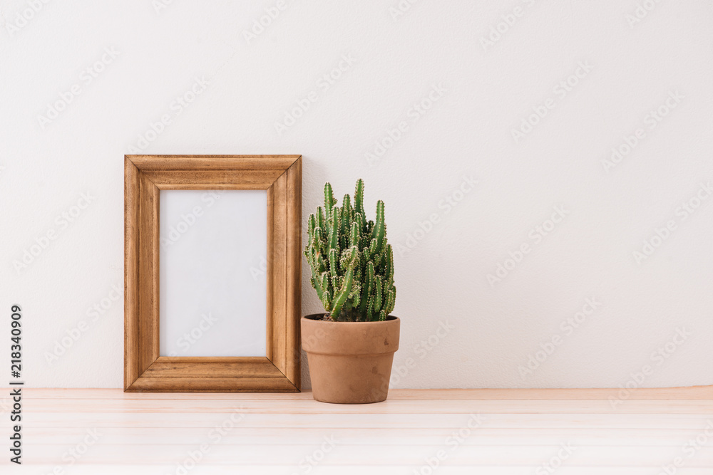 Fototapeta premium mock up frame with cactus pot on wooden floor