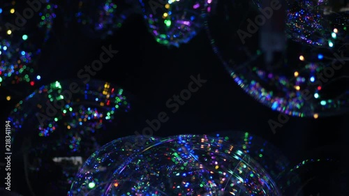 Colorful spheres are fluttering on the light breeze