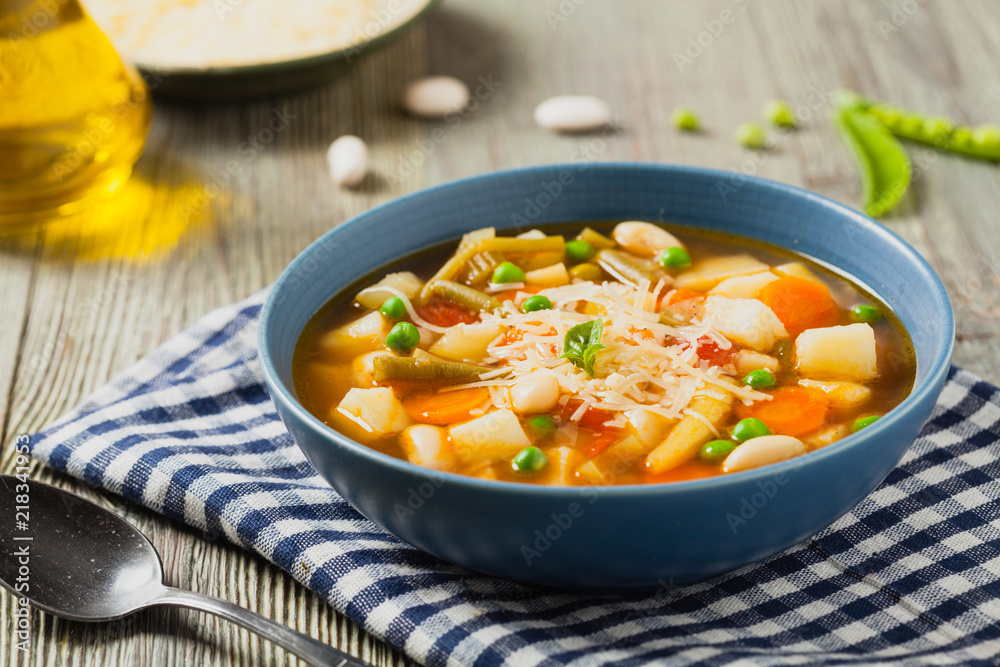 Minestrone soup with pasta and cheese.