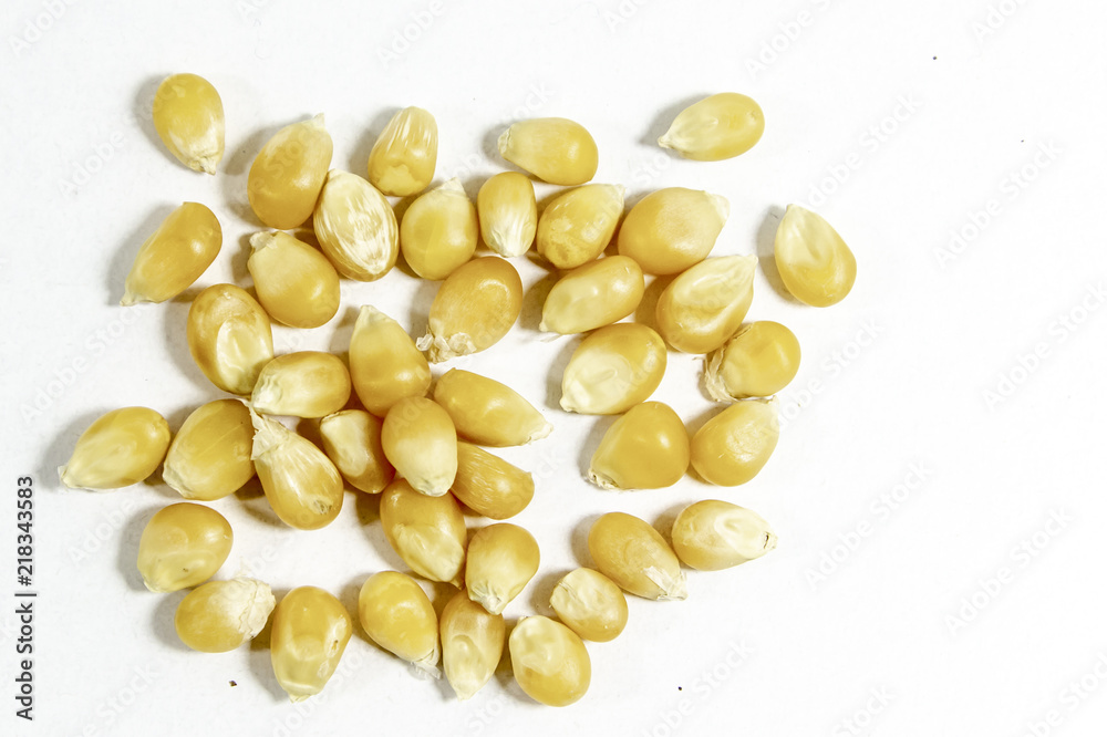 Fototapeta premium Top shot of corn seeds on white background
